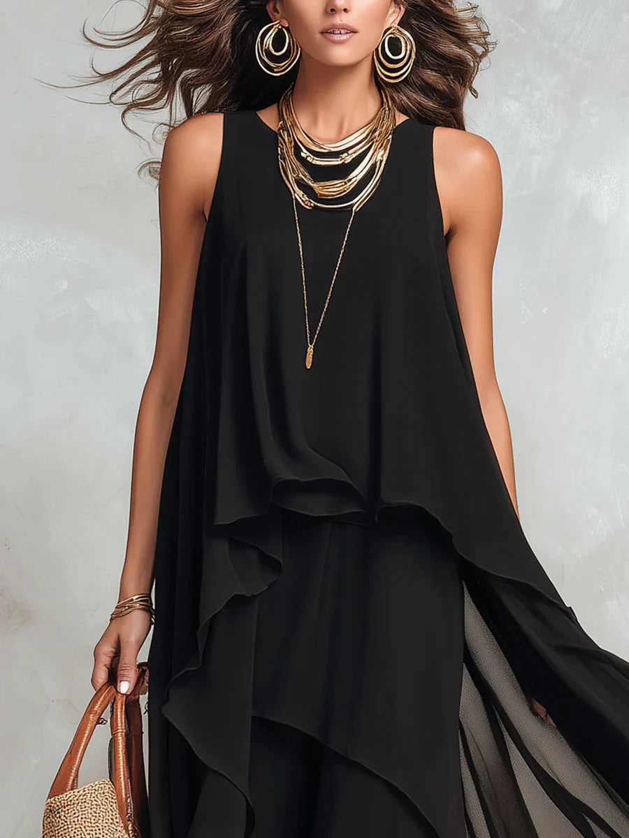 Maxi abito nero in chiffon a strati, senza maniche e con scollo rotondo